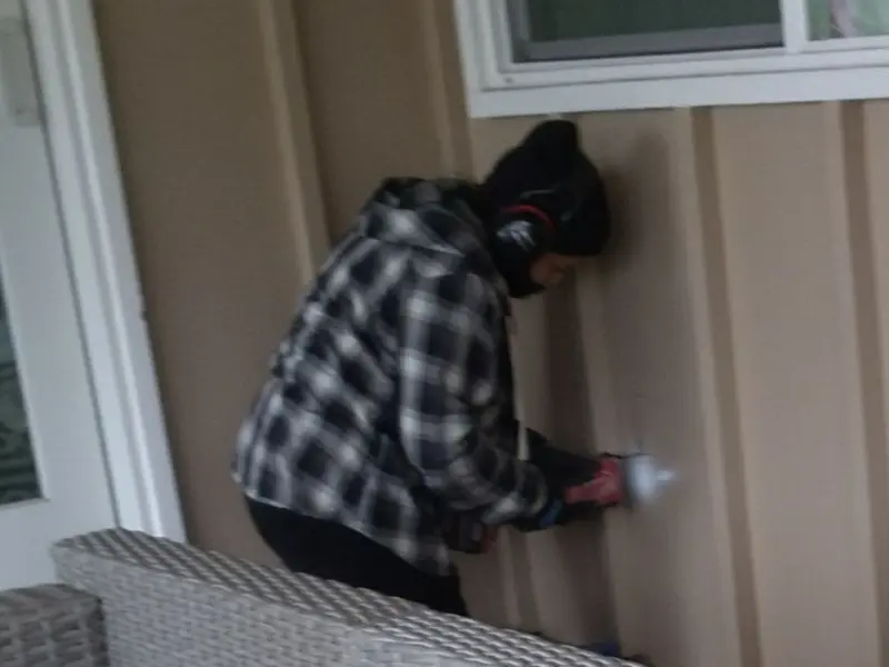 Professional electrician installing an exterior outlet in Newark